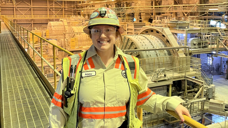 CPH alumna Abigail Tompkins poses at her workplace.