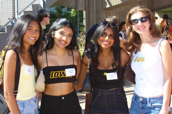 Four students pose at Homecoming 2025