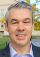 Portrait of Will Story, professor in the Department of Community and Behavioral Health at the University of Iowa College of Public Health.