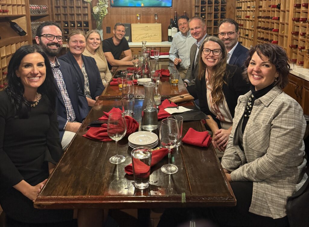 Faculty, staff, and alumni with WittKieffer personnel at dinner
