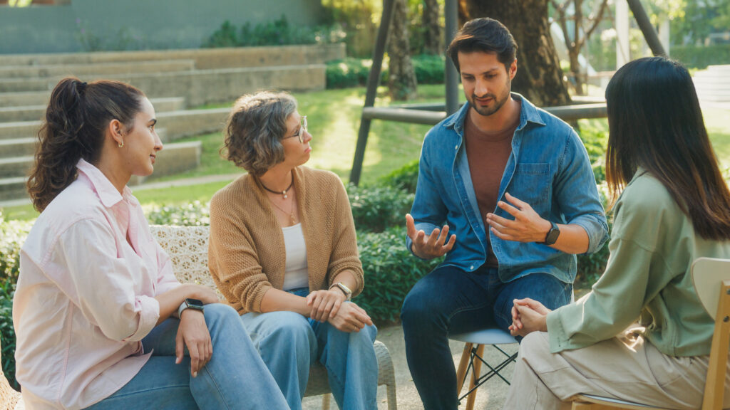 A group of adults sharing stories